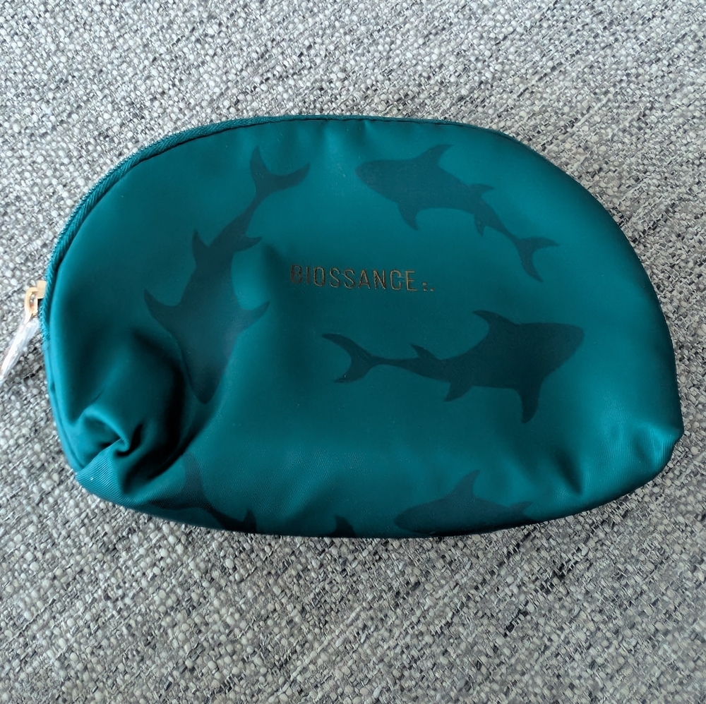 Biossance Teal Shark Print Pouch